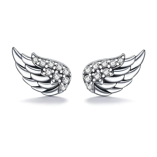 A pair of silver angel wing stud earrings, each adorned with small clear pavé gemstones, set against a clean white background.