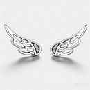 A pair of silver angel wing stud earrings with small clear crystal accents, displayed on a clean white background.